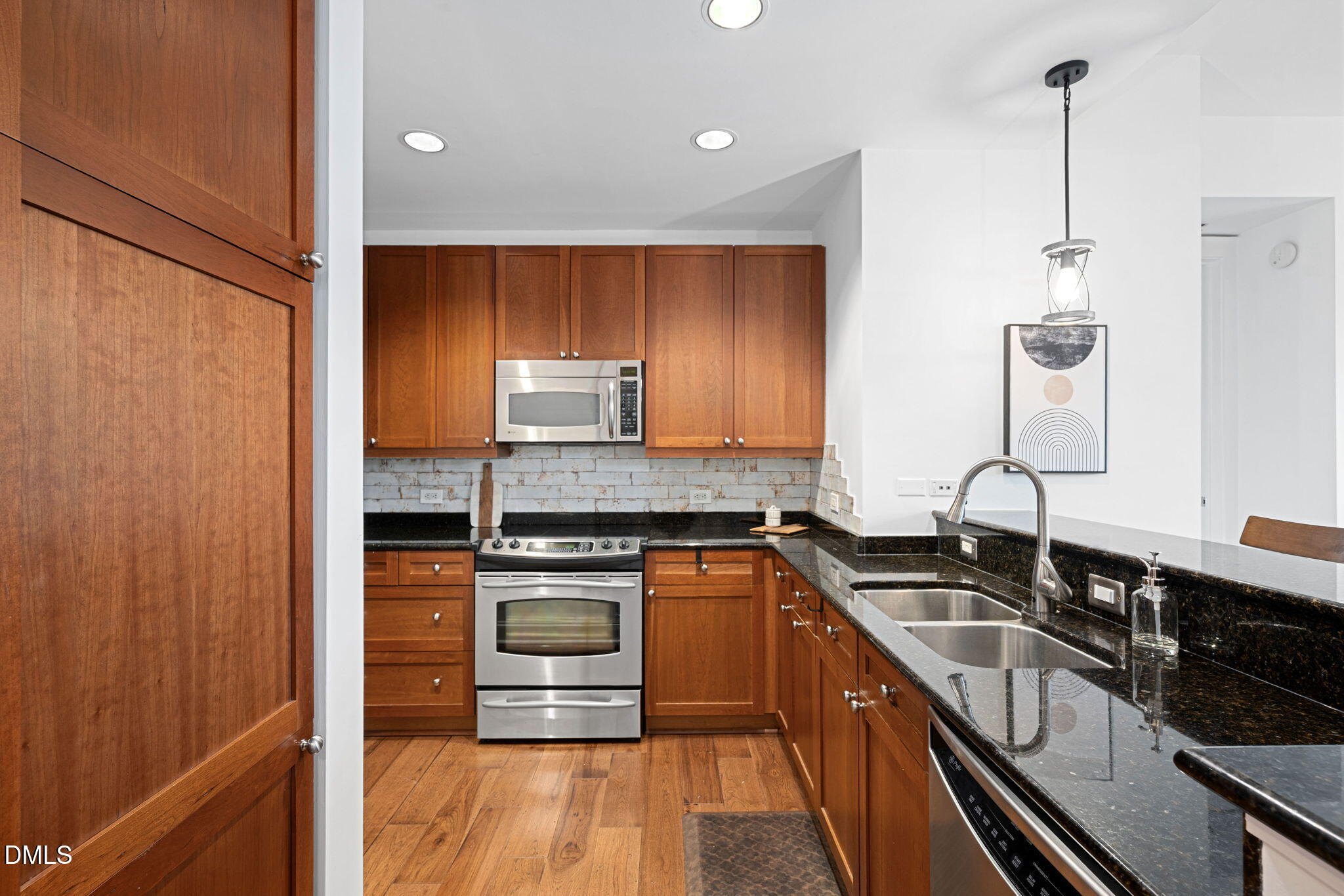 618 North Boylan Avenue, Unit 812 Raleigh, NC 27603 - Photo 13 of 35 a kitchen with stainless steel appliances granite countertop a sink stove and cabinets