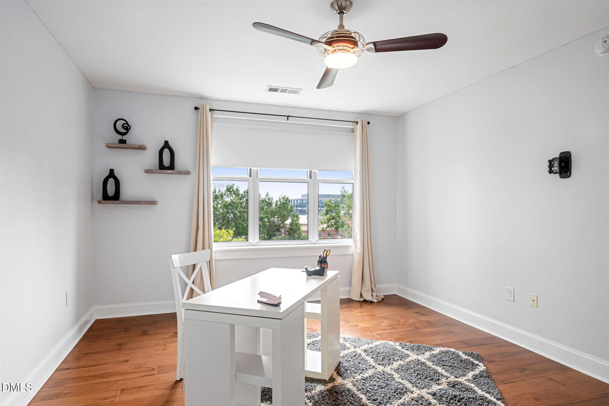 618 North Boylan Avenue, Unit 812 Raleigh, NC 27603 - Photo 19 of 35 an empty room with a window and a ceiling fan