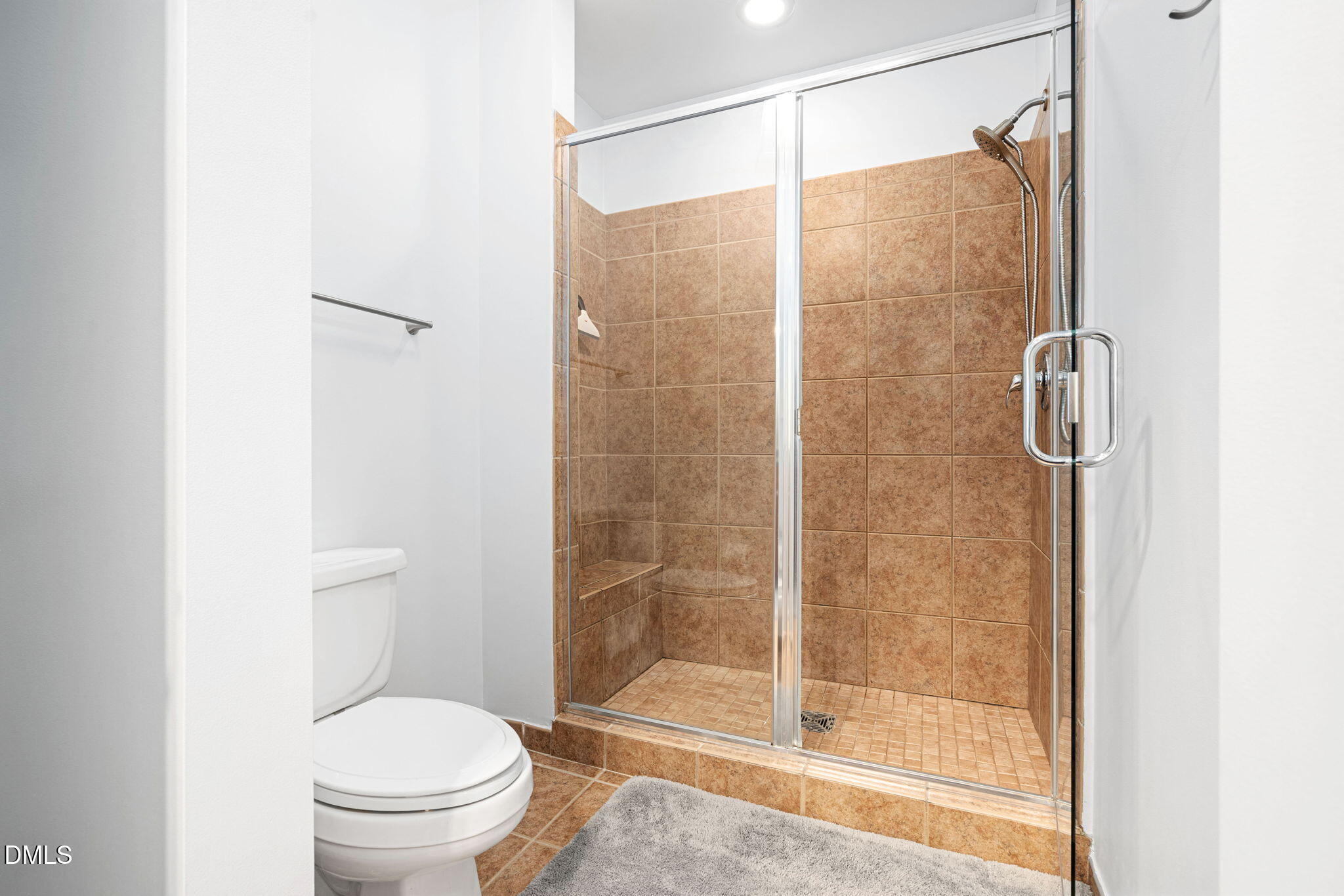 618 North Boylan Avenue, Unit 812 Raleigh, NC 27603 - Photo 23 of 35 a bathroom with a shower and a toilet