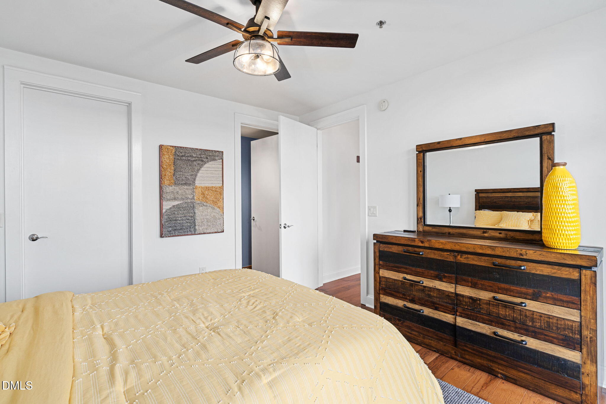 618 North Boylan Avenue, Unit 812 Raleigh, NC 27603 - Photo 26 of 35 a bedroom with a bed and a chandelier