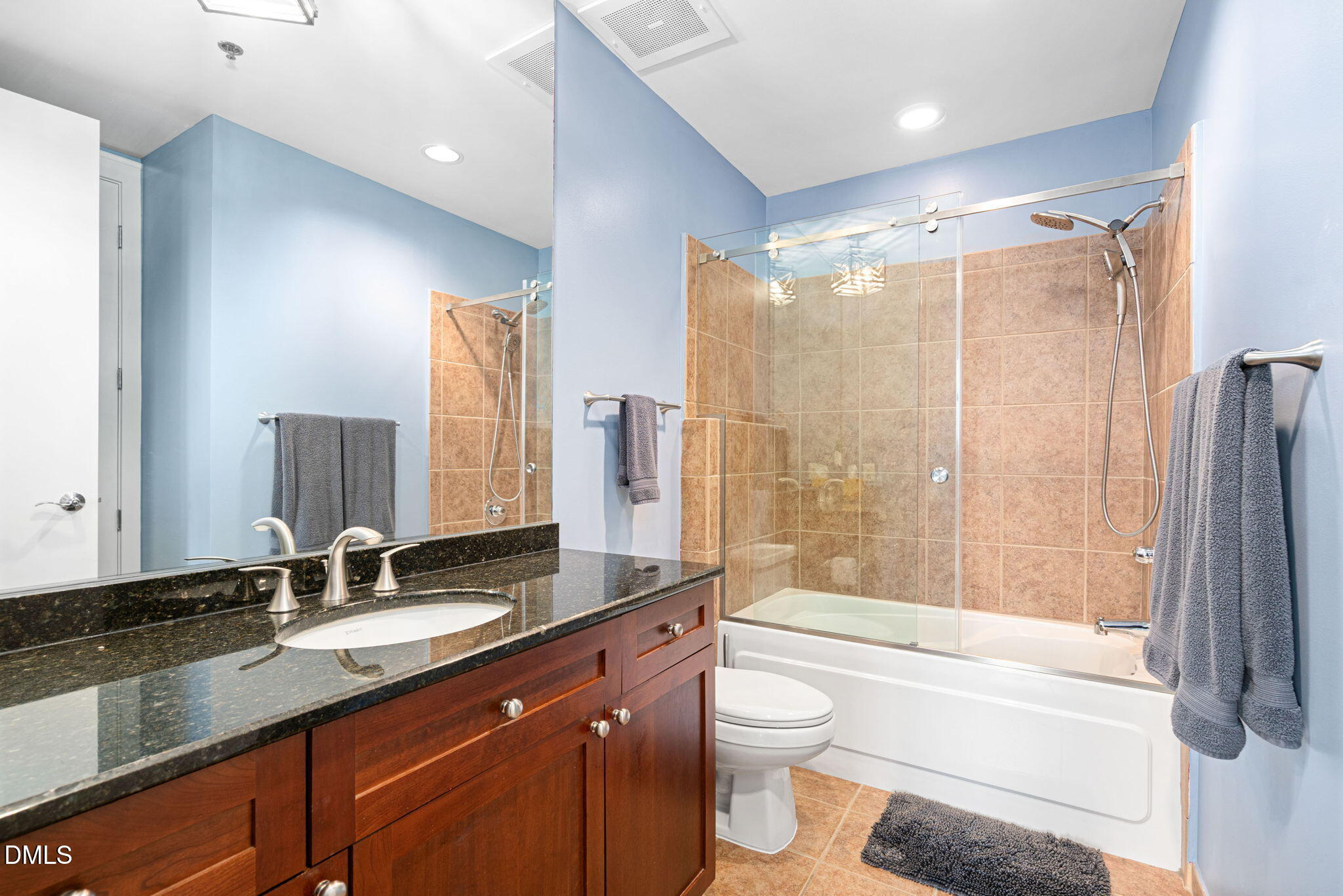 618 North Boylan Avenue, Unit 812 Raleigh, NC 27603 - Photo 27 of 35 a bathroom with a granite countertop sink toilet and shower