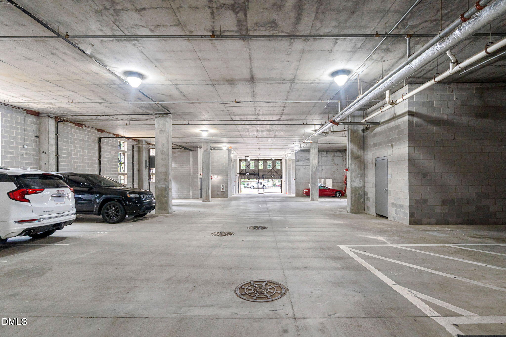 618 North Boylan Avenue, Unit 812 Raleigh, NC 27603 - Photo 29 of 35 a view of parking garage with cars