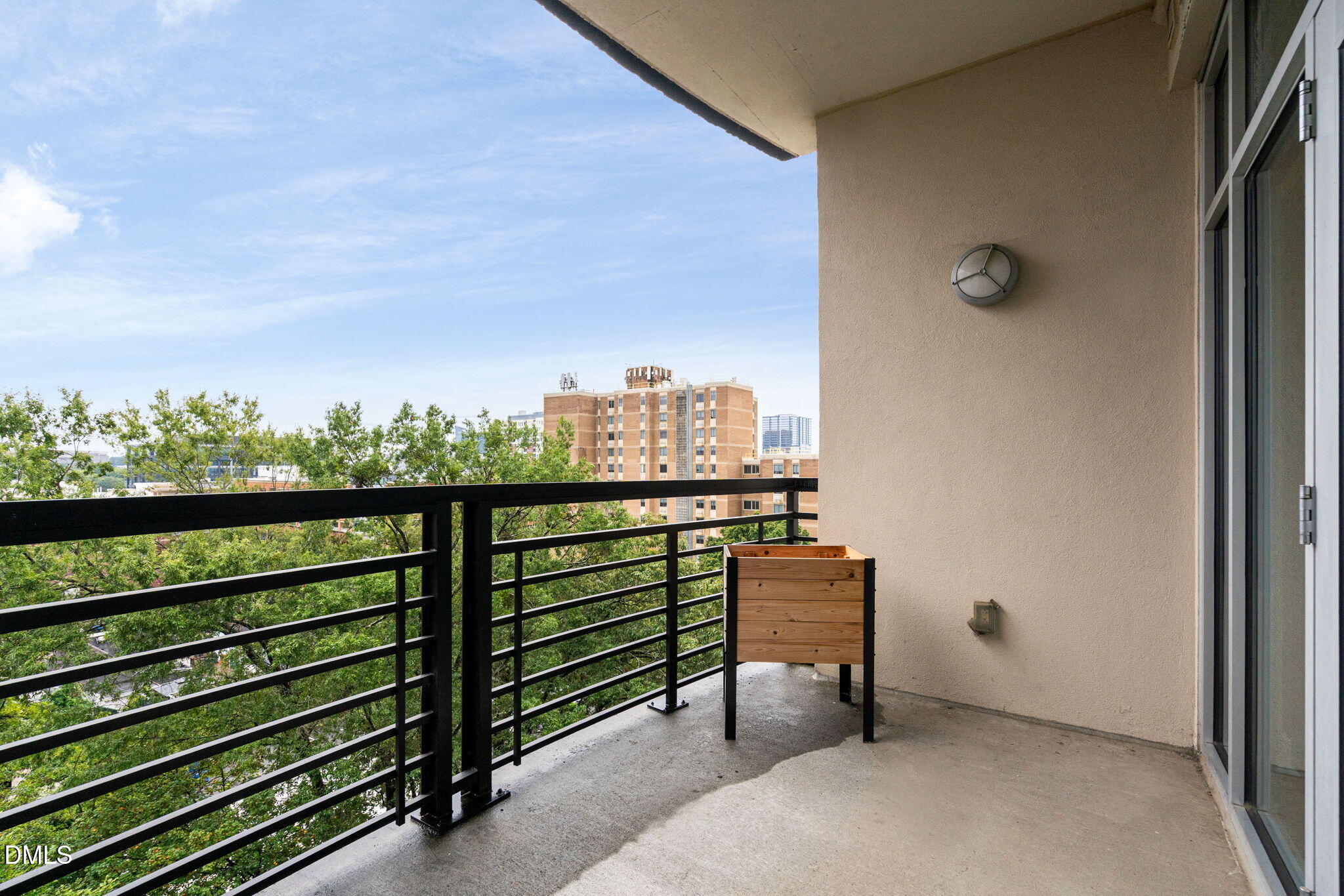 618 North Boylan Avenue, Unit 812 Raleigh, NC 27603 - Photo 6 of 35 a view of a balcony with chair and city view