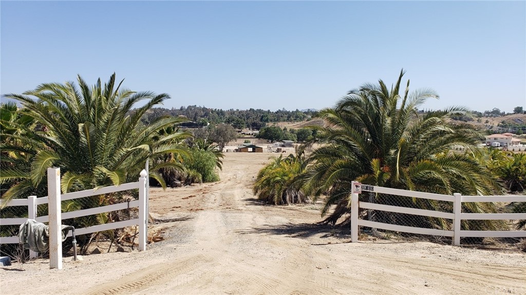 39300 Liefer Road Temecula, CA 92591 - Photo 26 of 28 a view of a terrace with a chair and floor to ceiling window