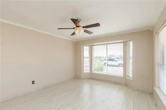 a view of an empty room with a window