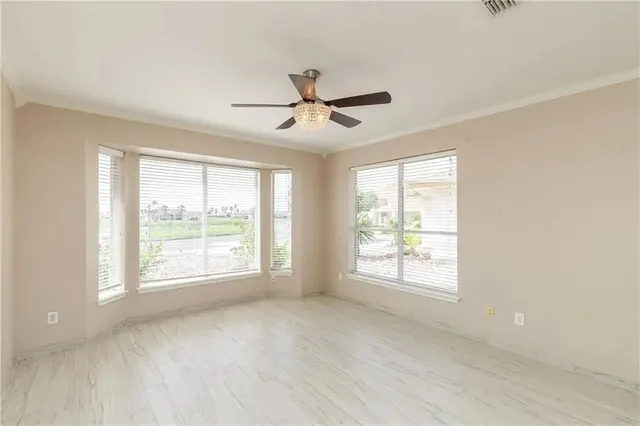 a view of an empty room with a window