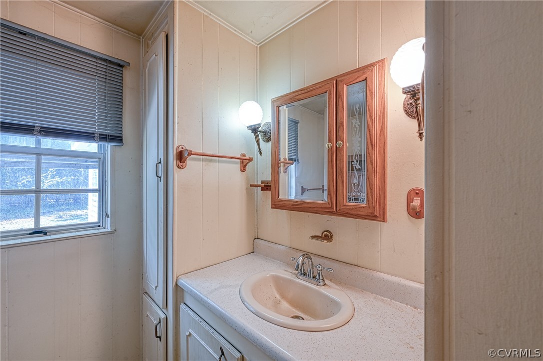 13287 Cross County Road Mineral, VA 23117 - Photo 23 of 27 a bathroom with a sink and a mirror