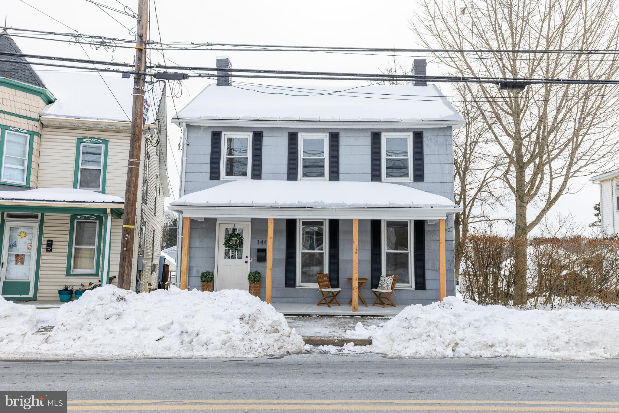 a view of a white house with a large windows