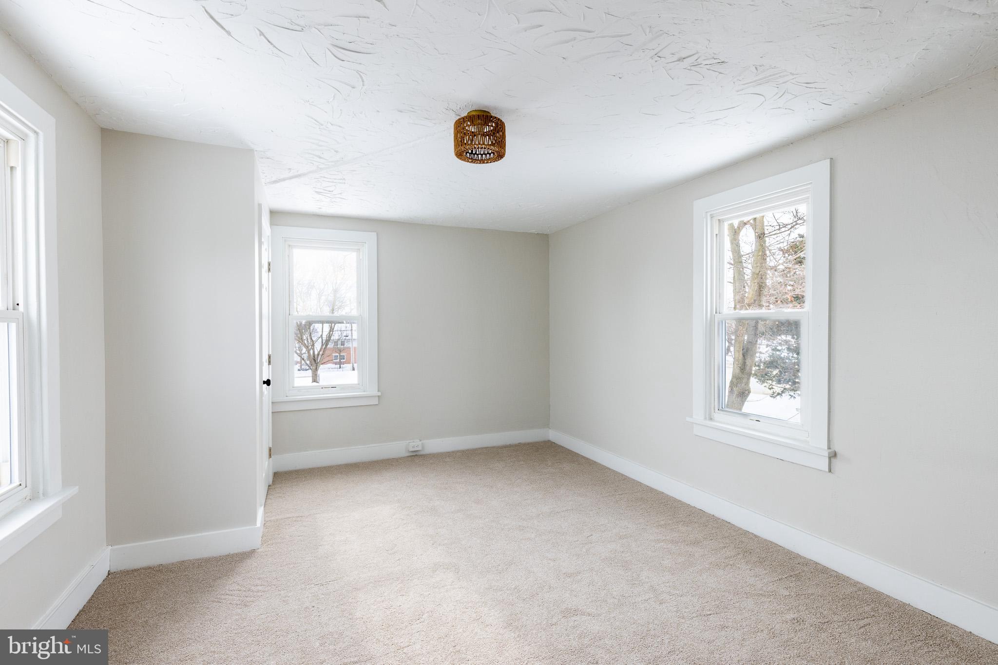 144 West King Street Littlestown, PA 17340 - Photo 12 of 20 an empty room with windows