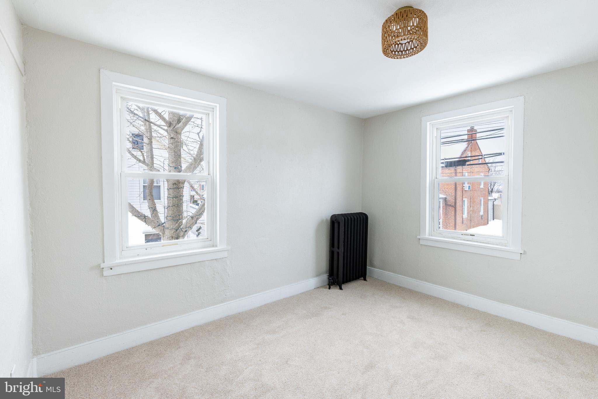 144 West King Street Littlestown, PA 17340 - Photo 13 of 20 a view of an empty room with a window
