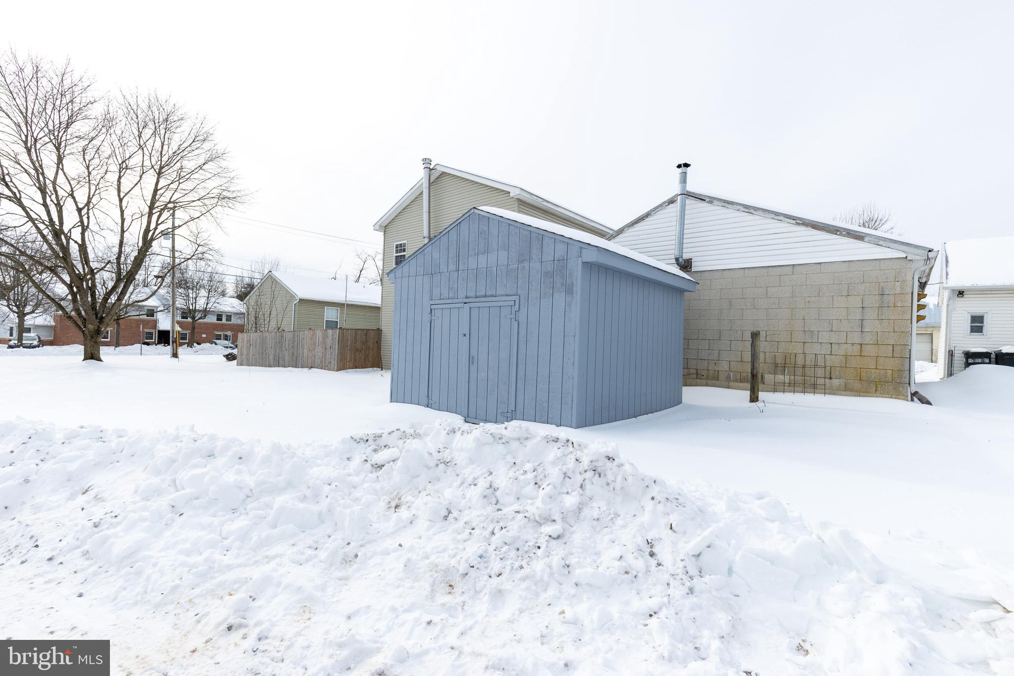 144 West King Street Littlestown, PA 17340 - Photo 19 of 20 a house with a covered with snow in front of it