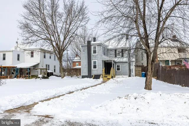 a street view covered with snow on the road