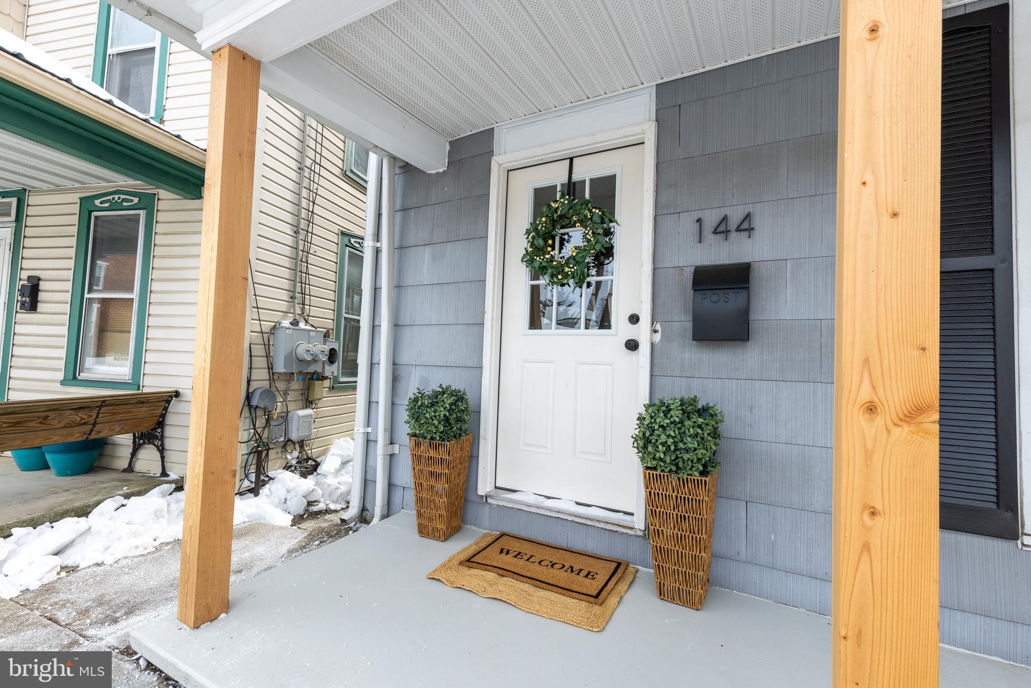 144 West King Street Littlestown, PA 17340 - Photo 2 of 20 a room with potted plants and a table