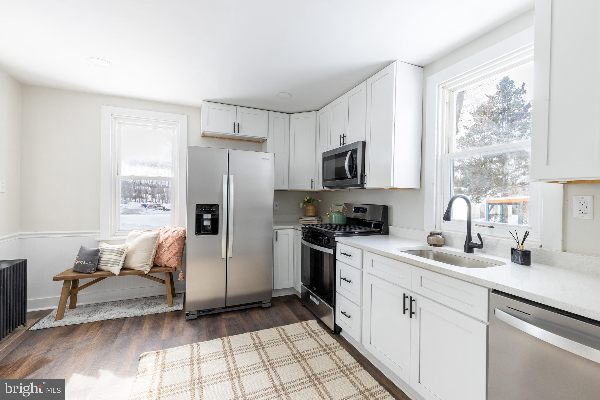 144 West King Street Littlestown, PA 17340 - Photo 7 of 20 a kitchen with a refrigerator and a sink