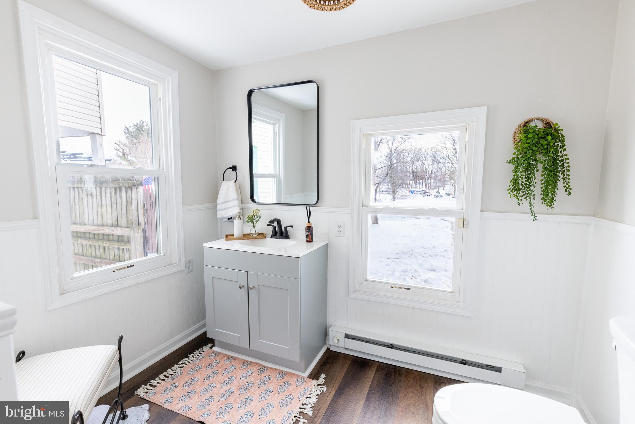 144 West King Street Littlestown, PA 17340 - Photo 10 of 20 a bathroom with a sink mirror and a window