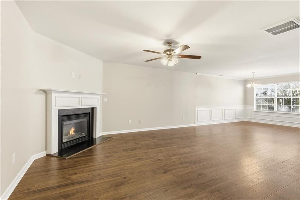 342 Hidden Creek Lane Canton, GA 30114 - Photo 10 of 30 a view of an empty room with exposed radiator and fireplace