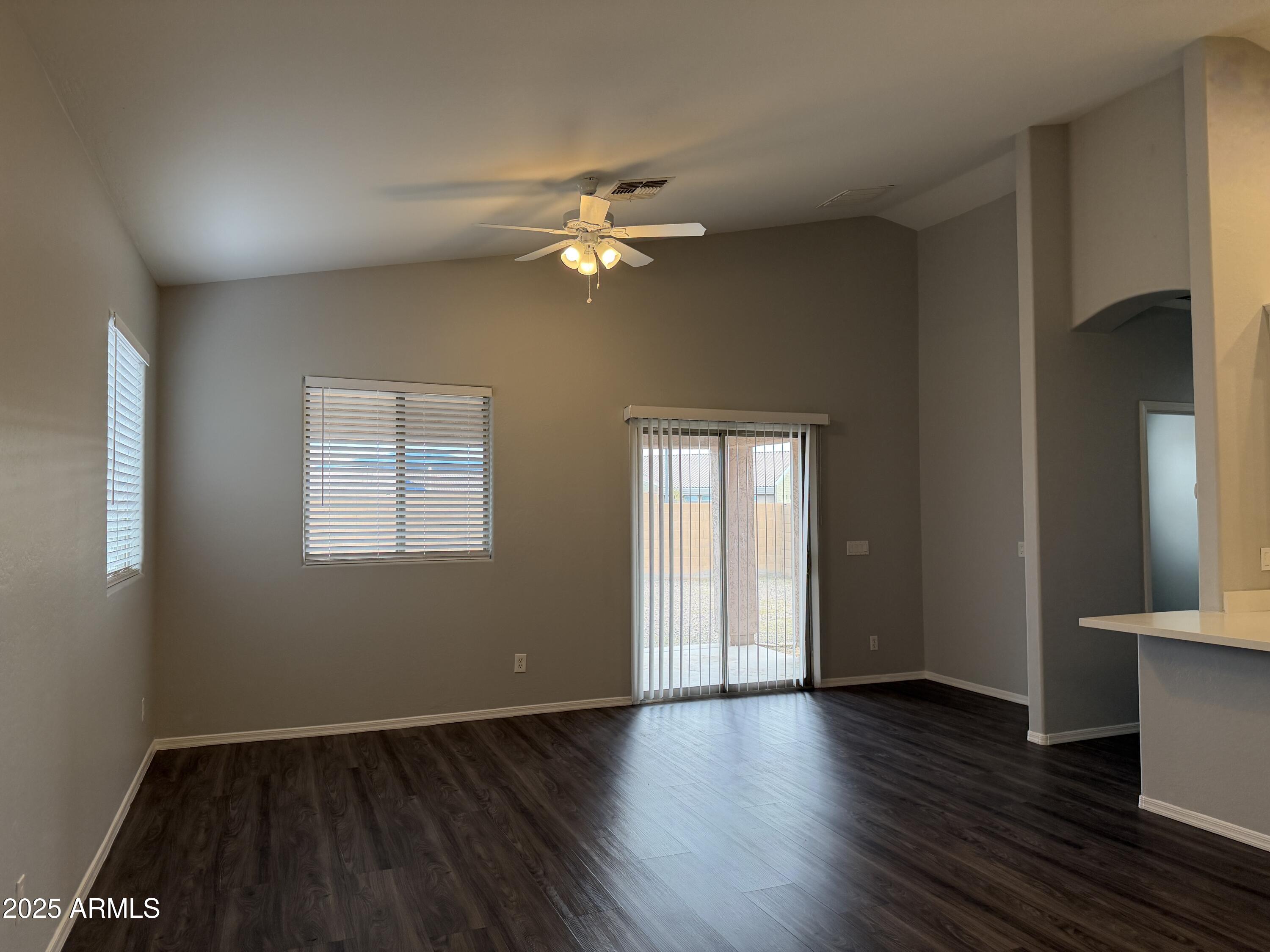 18123 North Madison Road Maricopa, AZ 85139 - Photo 14 of 26 a view of empty room with wooden floor and fan
