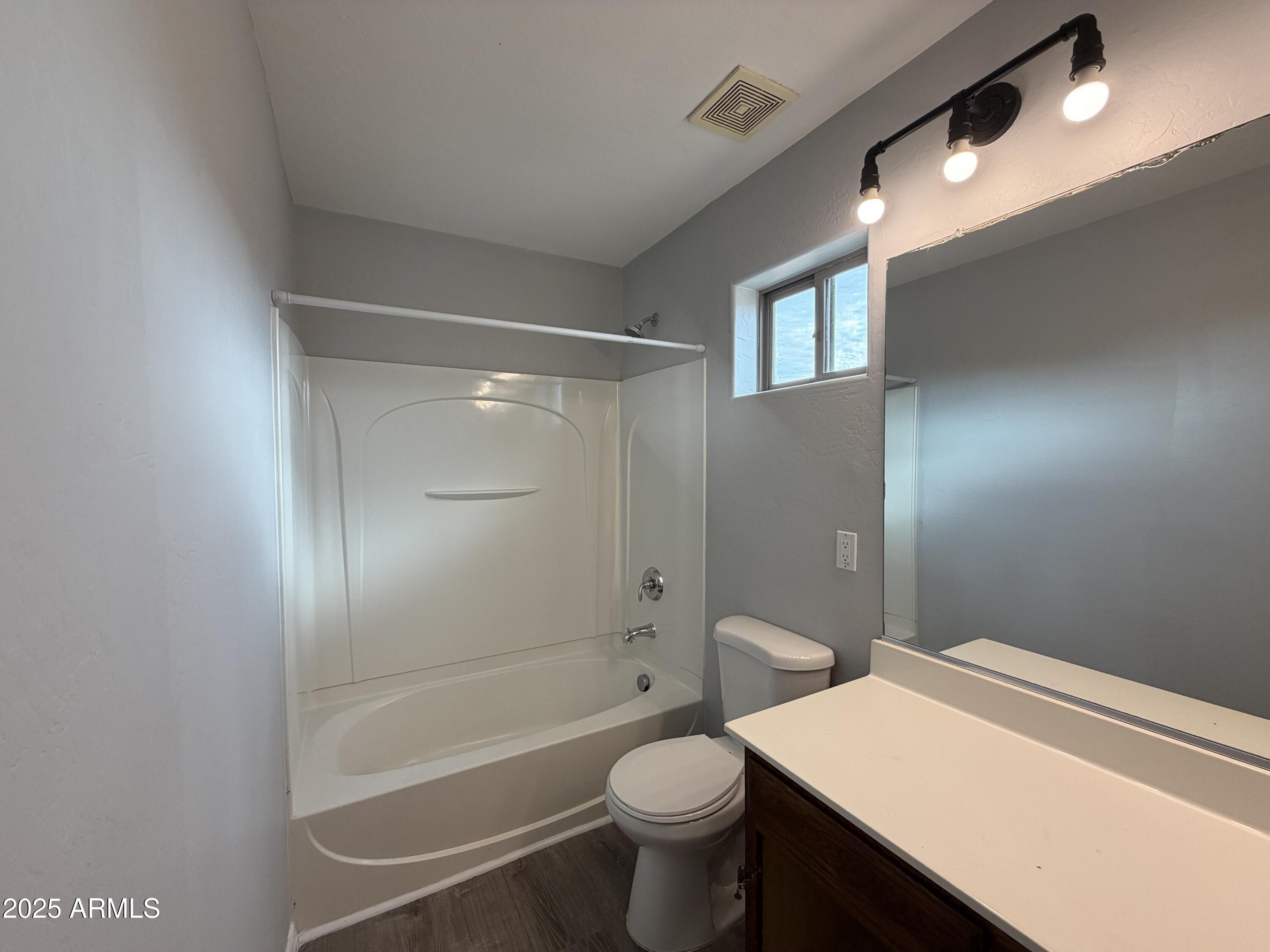 18123 North Madison Road Maricopa, AZ 85139 - Photo 23 of 26 a bathroom with a sink a toilet and shower