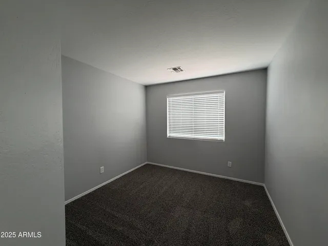an empty room with a empty space and a window