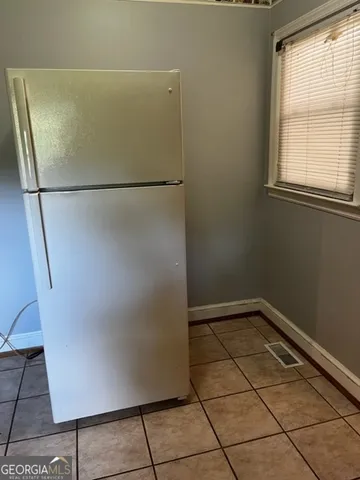 a view of a refrigerator in a room