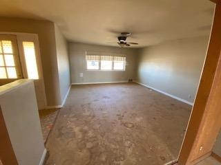682 County Road 1038 Muleshoe, TX 79347 - Photo 2 of 23 wooden floor in an empty room with a window