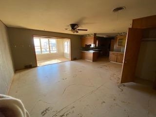 682 County Road 1038 Muleshoe, TX 79347 - Photo 4 of 23 a view of a kitchen with a sink cabinet and a window