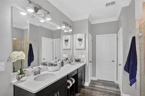 a kitchen with stainless steel appliances kitchen island granite countertop a sink and cabinets
