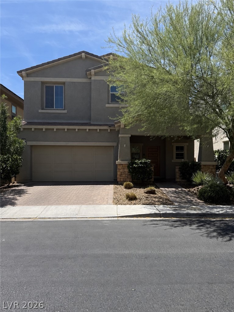 3053 Echoed Rondel Lane Henderson, NV 89044 - Photo 1 of 1 A well-maintained facade with a two-car garage and inviting entryway.