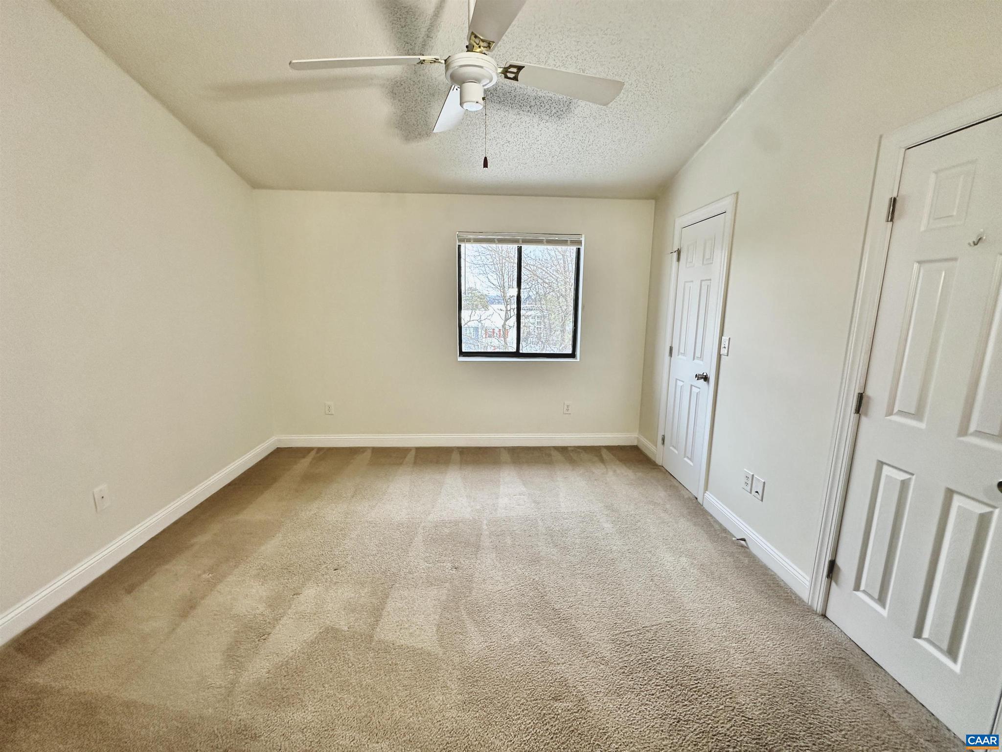 139 Green Turtle Lane, Unit 10 Charlottesville, VA 22901 - Photo 18 of 26 wooden floor in an empty room with a window