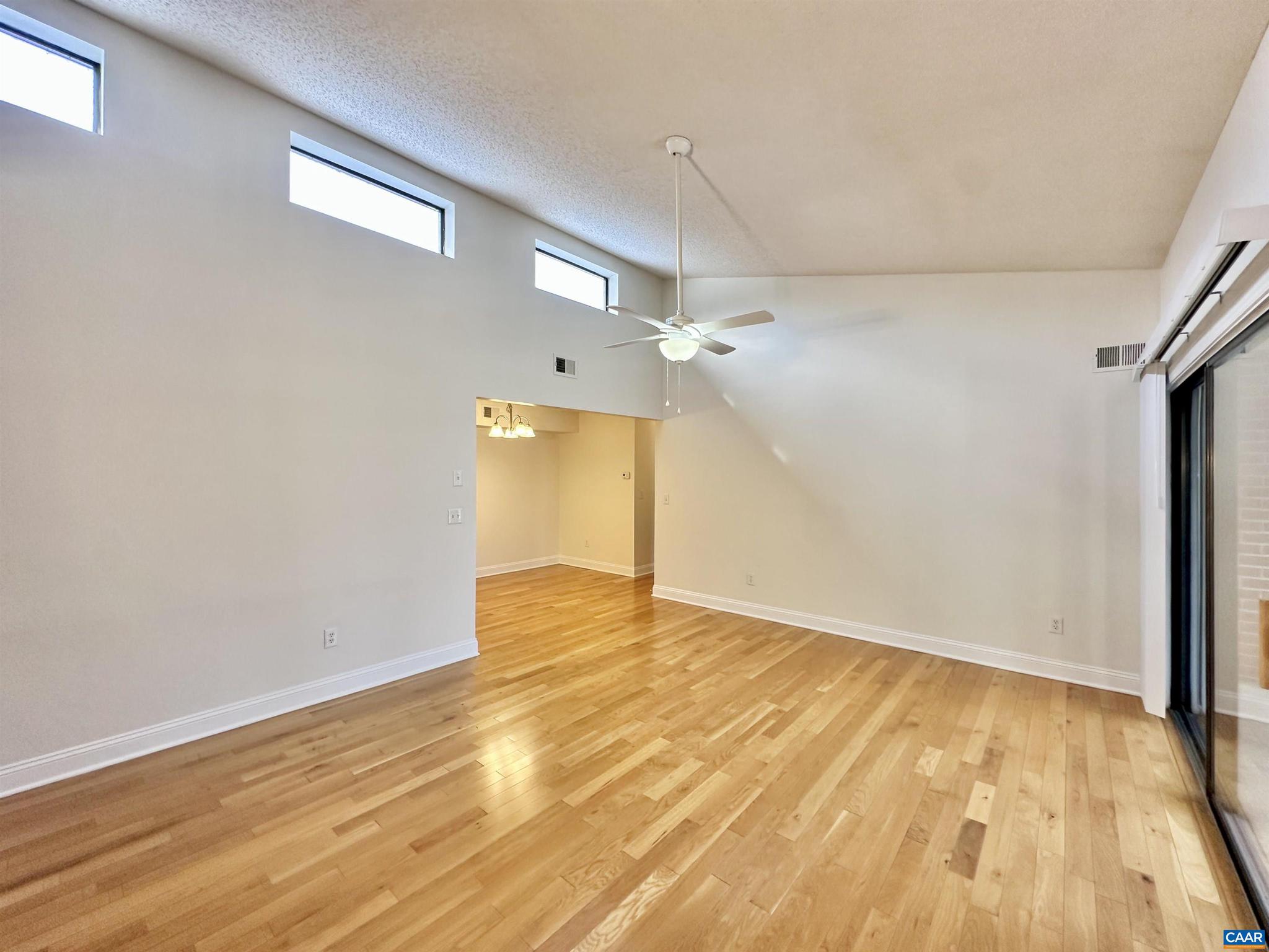 139 Green Turtle Lane, Unit 10 Charlottesville, VA 22901 - Photo 3 of 26 a view of empty room with wooden floor