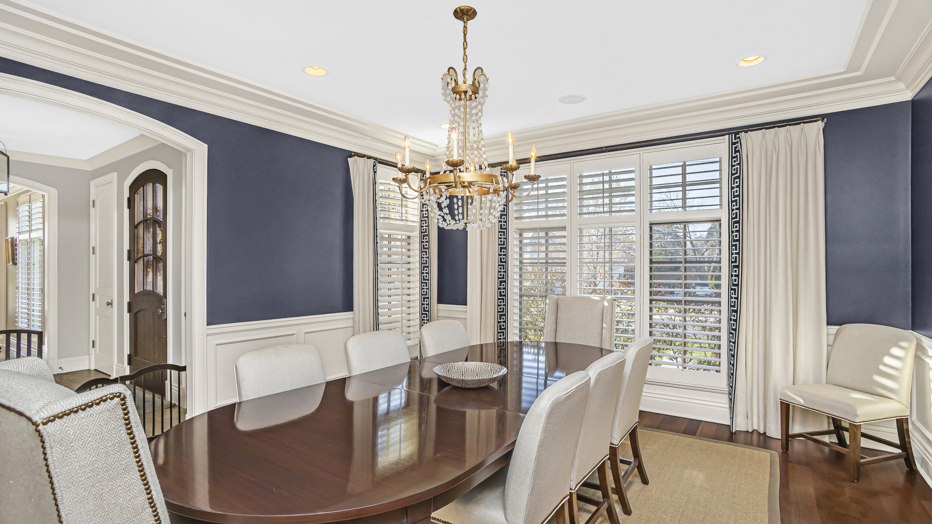 833 Chatham Road Glenview, IL 60025 - Photo 11 of 50 a dining room with furniture a chandelier and wooden floor