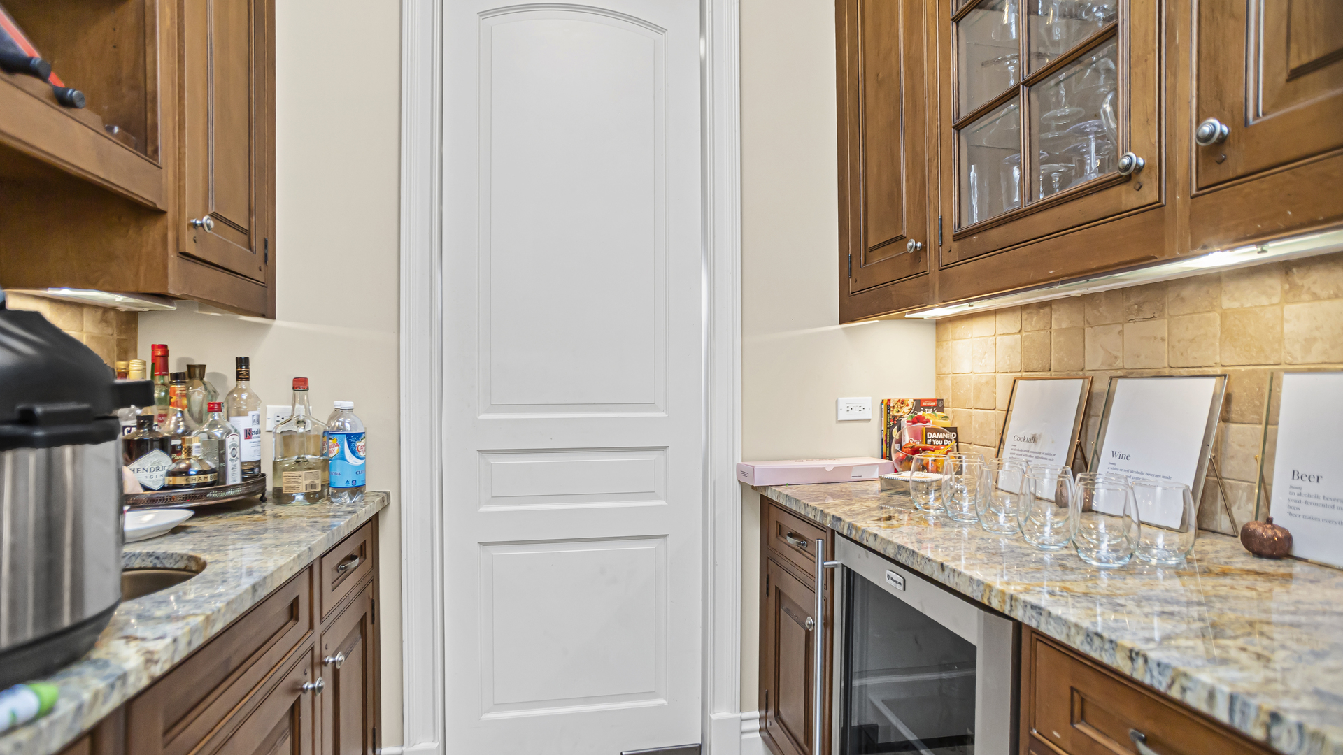 833 Chatham Road Glenview, IL 60025 - Photo 15 of 50 a kitchen with granite countertop a sink and a stove