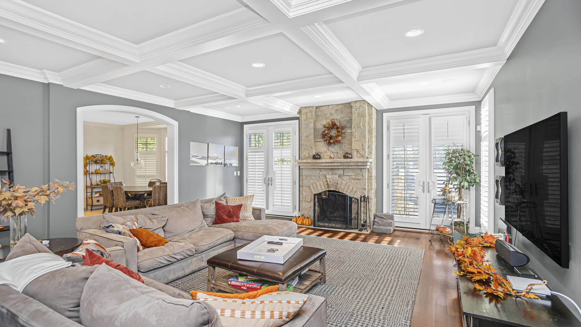 833 Chatham Road Glenview, IL 60025 - Photo 16 of 50 a living room with furniture a flat screen tv and a fireplace