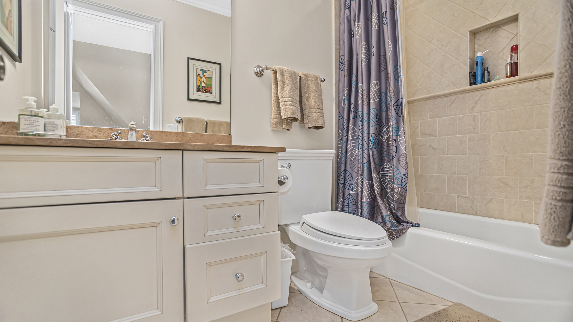 833 Chatham Road Glenview, IL 60025 - Photo 33 of 50 a bathroom with a granite countertop sink toilet a mirror and shower
