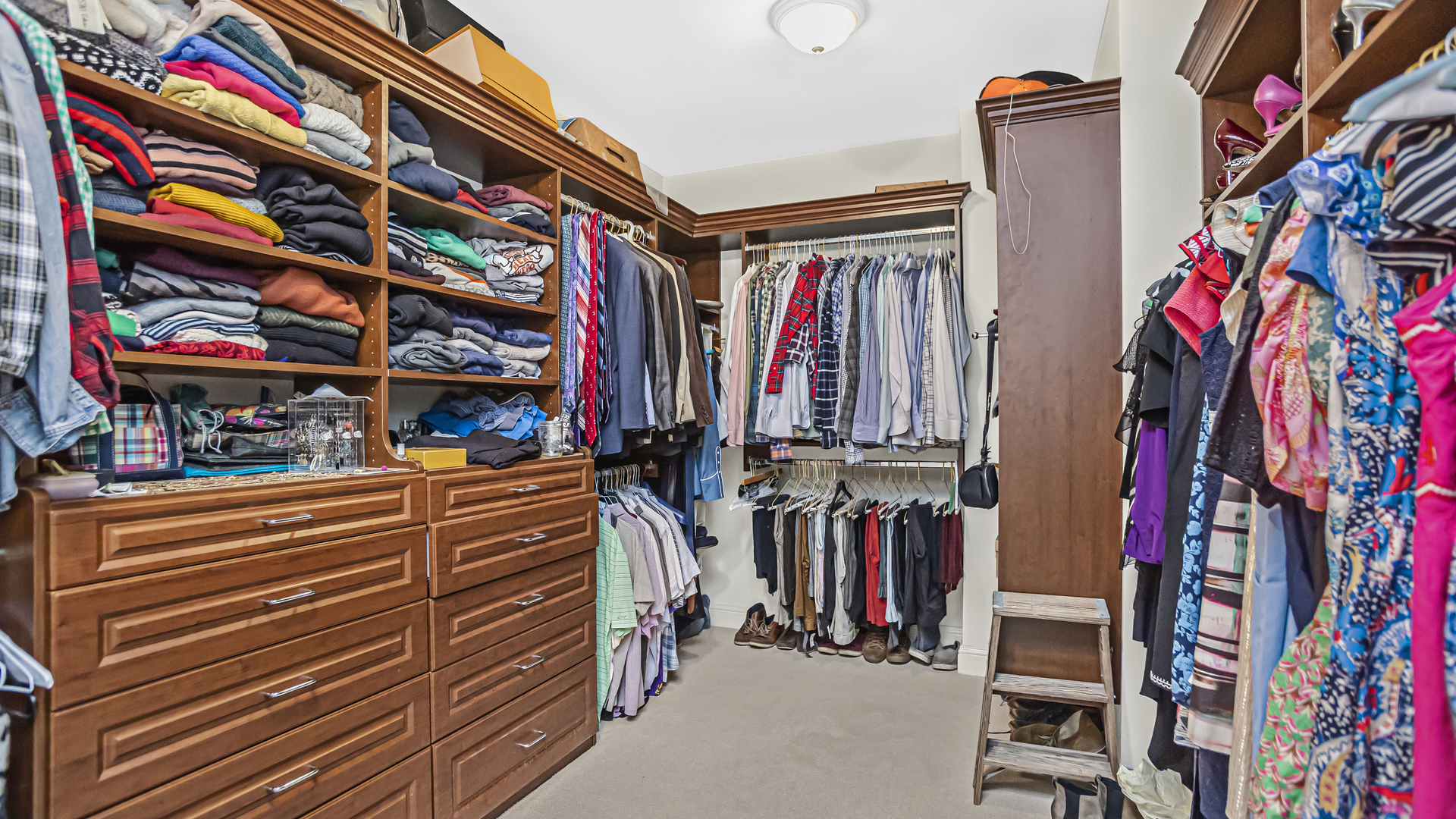 833 Chatham Road Glenview, IL 60025 - Photo 38 of 50 a view of walk in closet with clothes and shoes