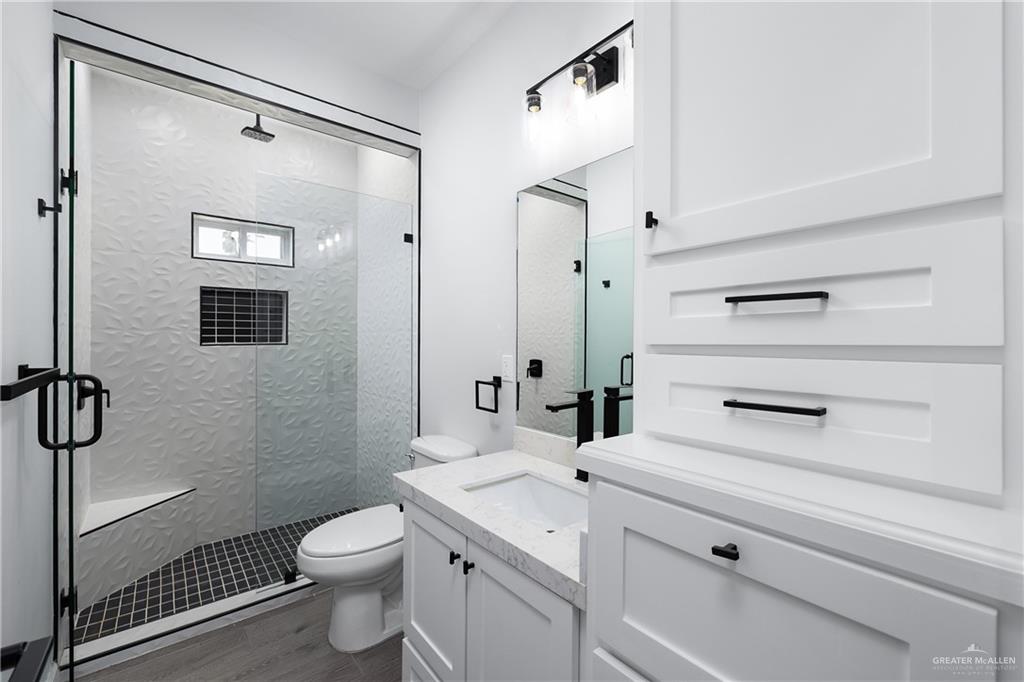 2443 Lady Palm Drive Rio Grande City, TX 78582 - Photo 15 of 19 a bathroom with a sink a toilet and shower