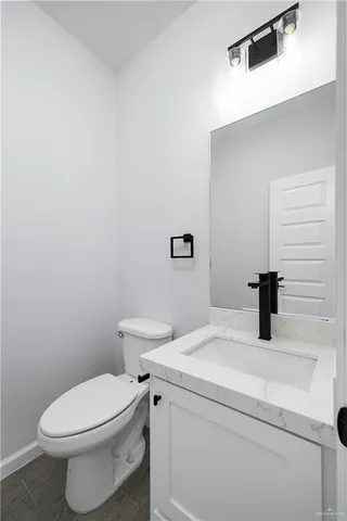 a bathroom with a toilet and a sink