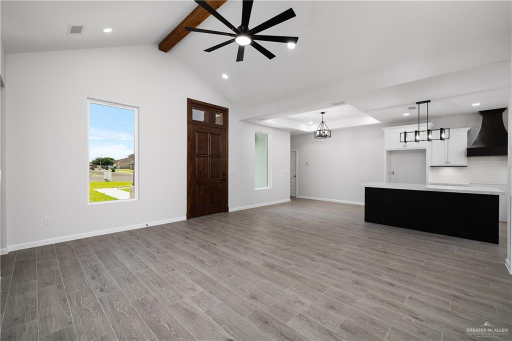 2443 Lady Palm Drive Rio Grande City, TX 78582 - Photo 6 of 19 a view of empty room with wooden floor and ceiling fan
