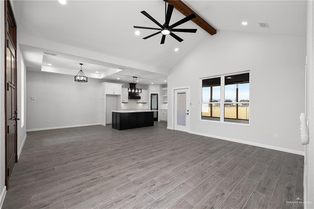 2443 Lady Palm Drive Rio Grande City, TX 78582 - Photo 7 of 19 a view of empty room with wooden floor and ceiling fan