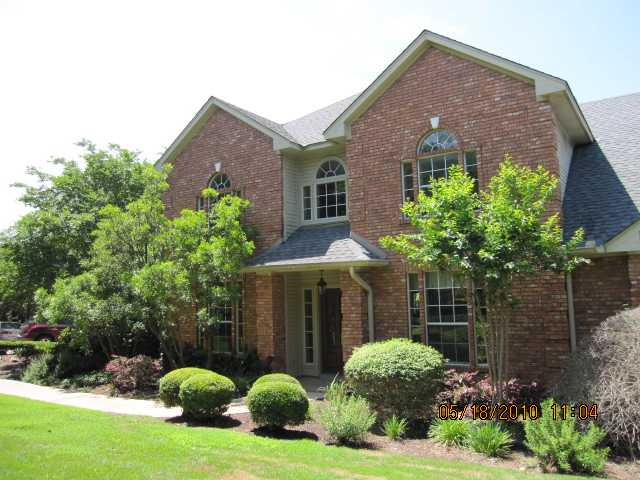704 Crystal Terrace Austin, TX 78733 - Photo 1 of 1 a front view of a house with garden