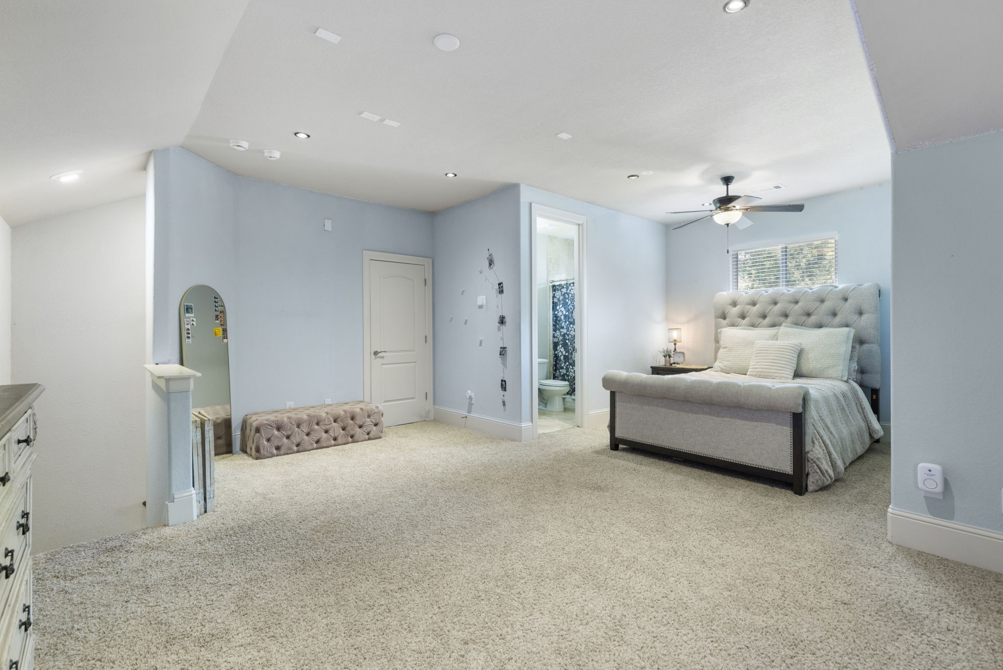 4103 Tee Tree Court Spring, TX 77386 - Photo 21 of 37 More than just a Bonus Room! This spacious upstairs area includes a ceiling fan, carpet, private en-suite bath, and walk-in access to the Texas Basement > the temperature-controlled entry area could also be converted to closet space.
