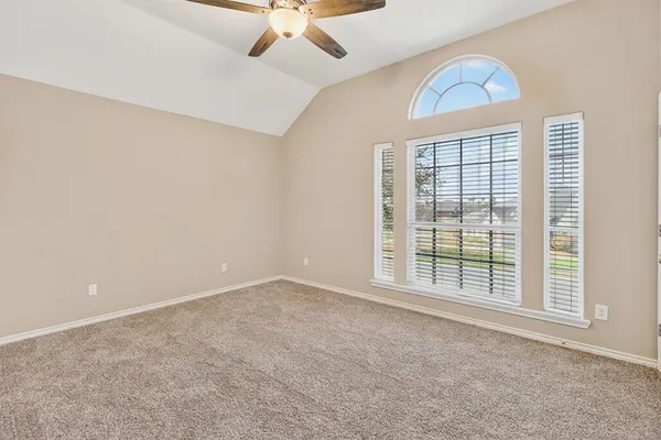 an empty room with a empty space and a window