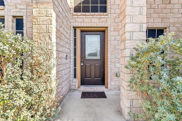 front view of a brick house with a large door