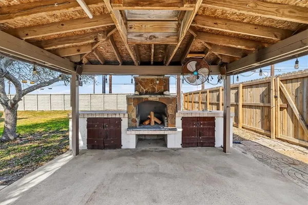 a view of an empty room with a fireplace