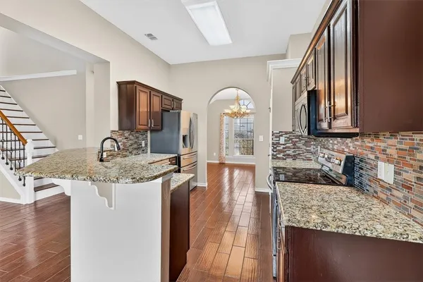 a view of living room with granite countertop furniture and fireplace