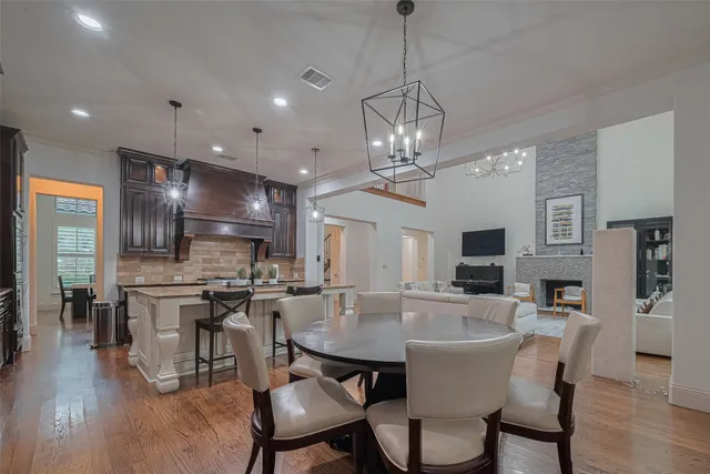 a large kitchen with a table and chairs