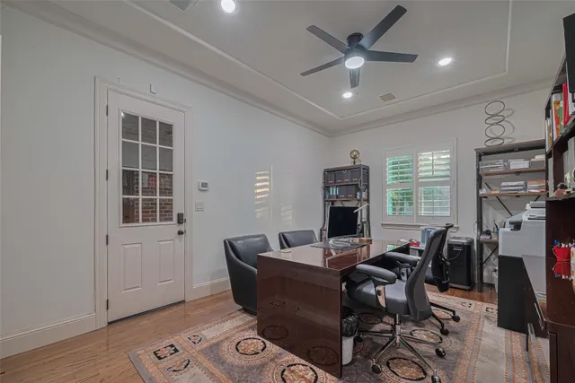 a living room with furniture a window and a flat screen tv