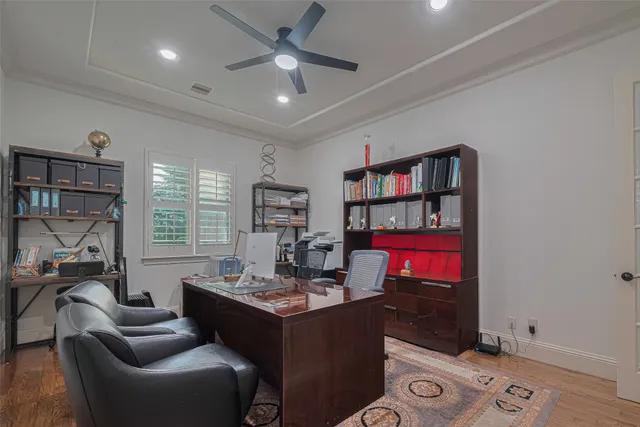 a living room with furniture a window and a bookshelf