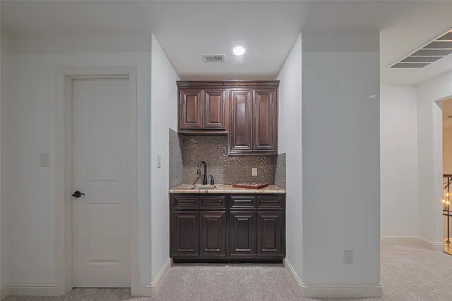 a view of a kitchen and utility room