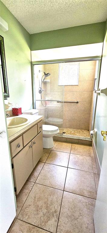 8274 Southwest 106th Place Ocala, FL 34481 - Photo 16 of 40 a bathroom with a sink a toilet and a shower